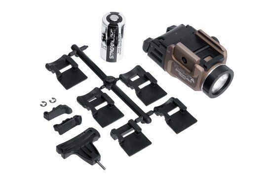Versatile FDE weapon mounted light with battery and multiple mounting options.